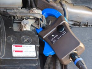 How to use a current clamp on a car battery