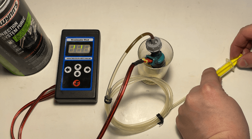 Injector Reanimator device used to clean clogged injector